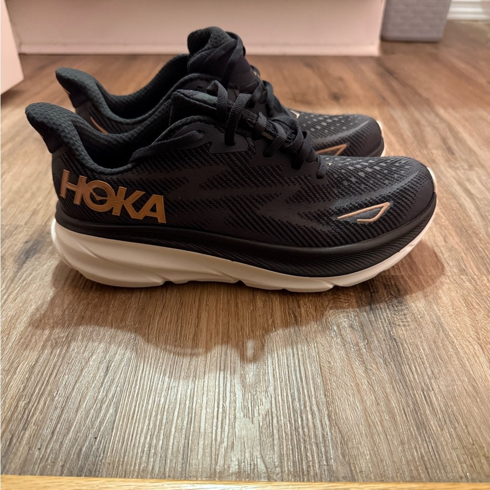 NEW! Hoka Clifton 9 Black and Gold Sneakers - Picture 3 of 5